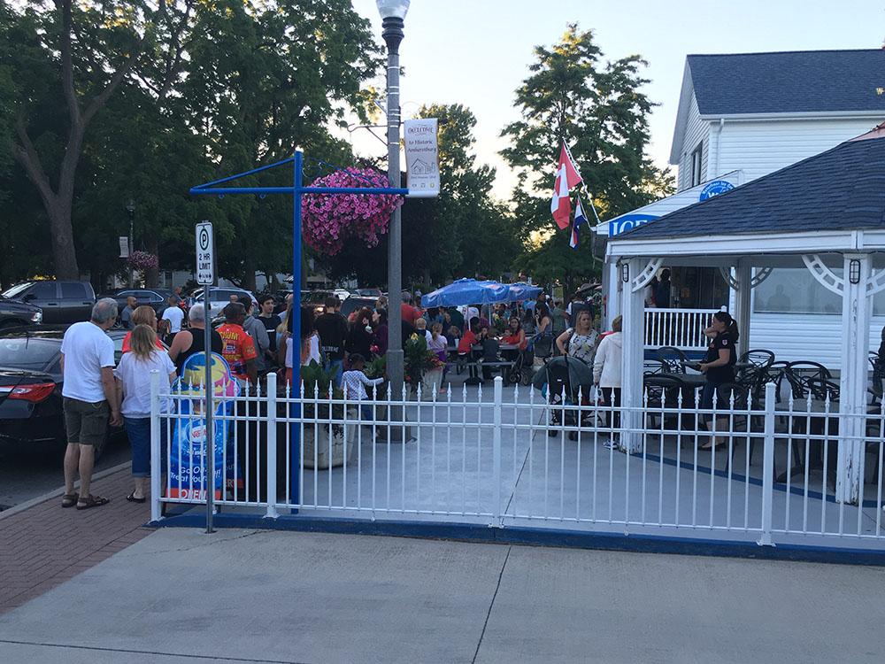 A crowd of people gathered in front of a building.