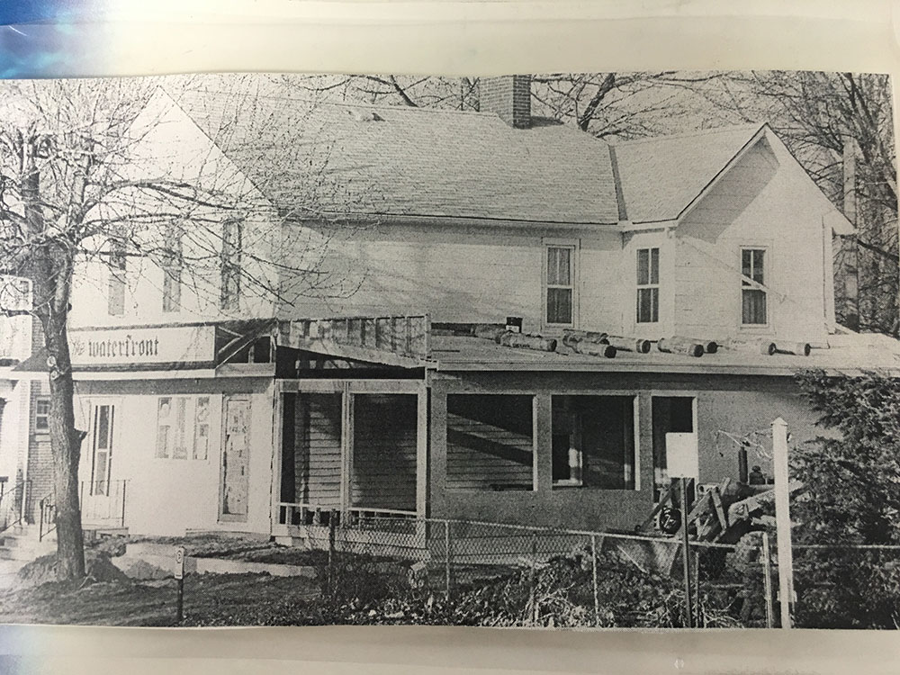 A black and white photo of an old house.