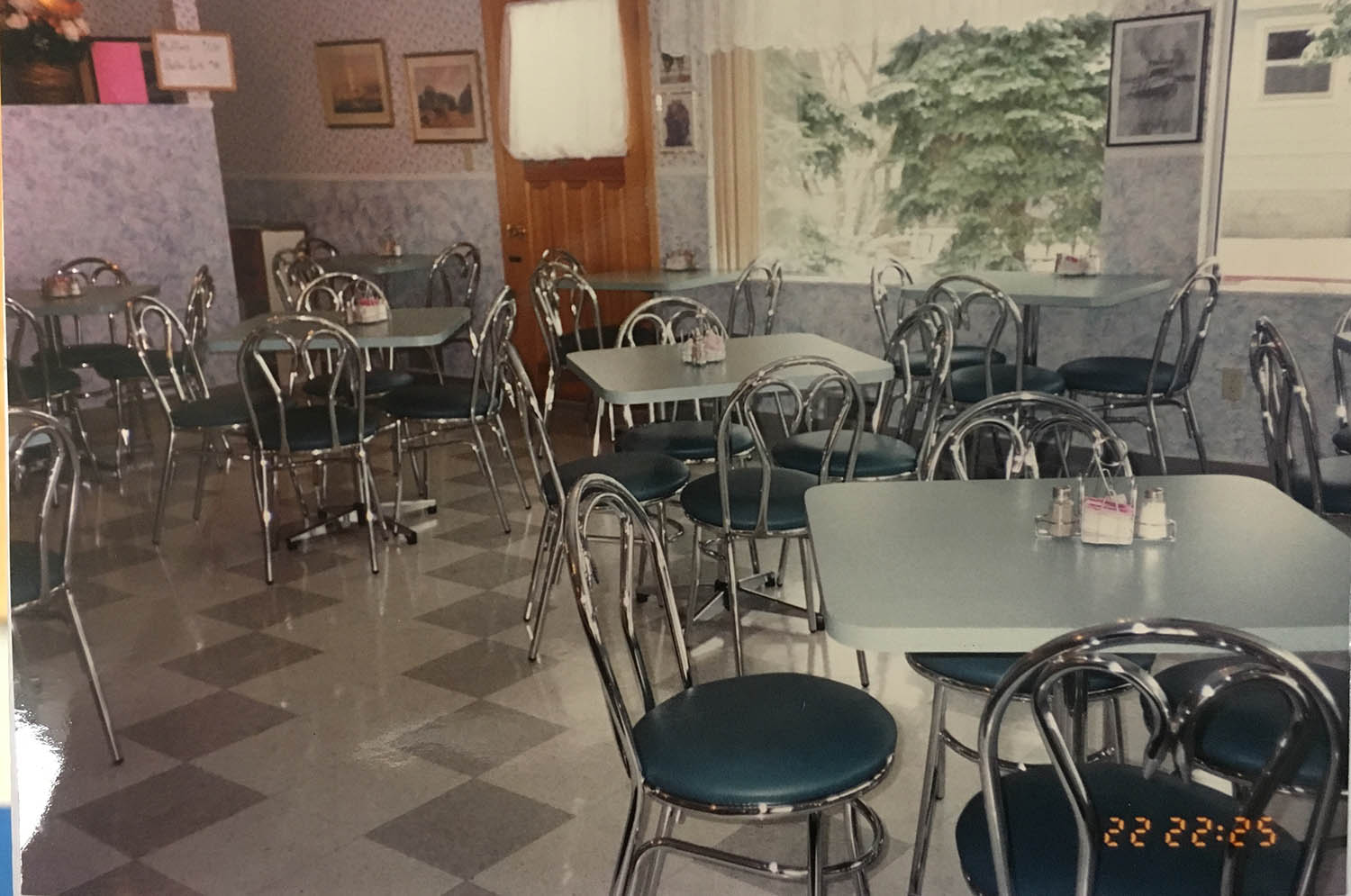 A restaurant with tables and chairs in it