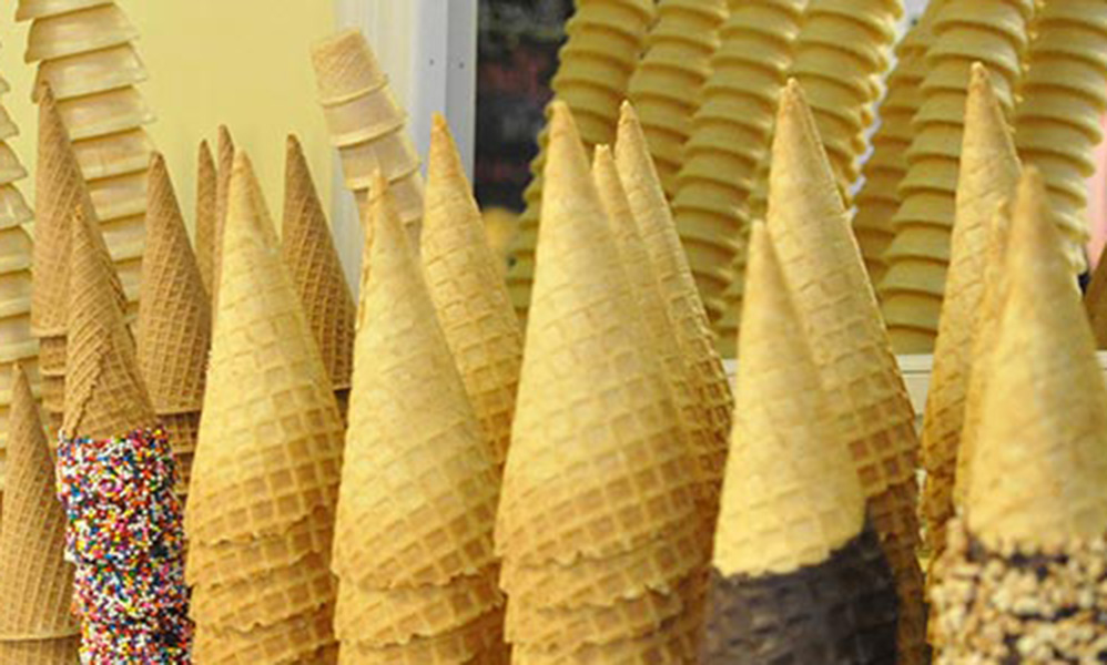 A close up of some cones with different flavors